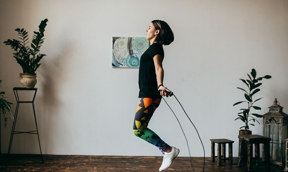 girl doing an exercise with a jump rope